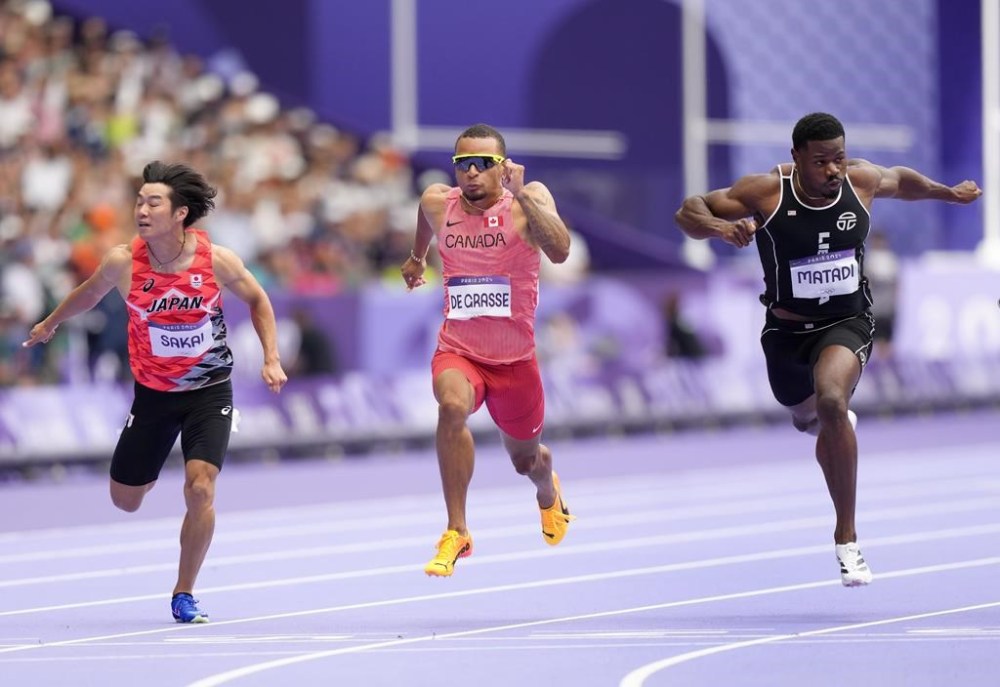 From the 3x3 basketball to qualifiers for the men's 200-metre race, here are five things to look out for at the Paris Olympics on Monday, Aug. 5. Canada's Andre De Grasse, centre, competes in the men's men's 100 meters round 1 heat at the 2024 Summer Olympics, Saturday, Aug. 3, 2024, in Saint-Denis, France. THE CANADIAN PRESS/Nathan Denette