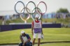 Scottie Scheffler, of the United States, looks at his putt on the 18th green during the final round of the men's golf at the 2024 Summer Olympics, Sunday, Aug. 4, 2024, at Le Golf National in Saint-Quentin-en-Yvelines, France. (AP Photo/Matt York)