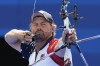 Brady Ellison of the United States lines up a shot in the men's individual archery final against South Korea's Kim Woo-jin, at the 2024 Summer Olympics, Sunday, Aug. 4, 2024, in Paris, France. (AP Photo/Rebecca Blackwell)