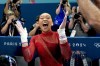 Suni Lee, of the United States, celebrates after winning the bronze medal during the women's artistic gymnastics individual uneven bars finals at Bercy Arena at the 2024 Summer Olympics, Sunday, Aug. 4, 2024, in Paris, France. (AP Photo/Charlie Riedel)
