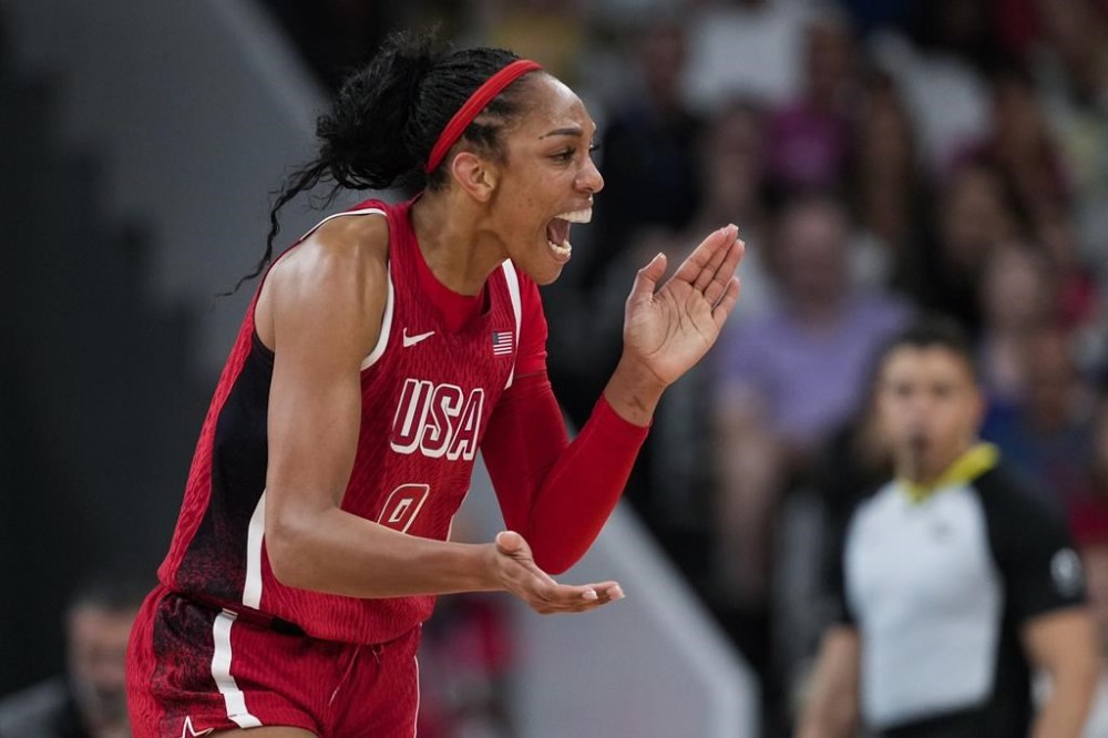 A'ja Wilson (9), of the United States, celebrate against Germany in a women's basketball game at the 2024 Summer Olympics, Sunday, Aug. 4, 2024, in Villeneuve-d'Ascq, France. (AP Photo/Mark J. Terrill)