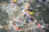 Australia's Natalie Van Coevorden (15), Belgium's Claire Michel (5) and Ekaterina Shabalina, of Kazakhstan (32) compete in the swim leg of the women's individual triathlon competition at the 2024 Summer Olympics, Wednesday, July 31, 2024, in Paris, France. (AP Photo/David Goldman)