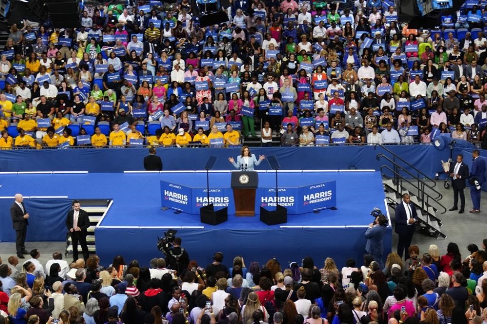 FILE - Vice President Kamala Harris speaks during a campaign rally, July 30, 2024, in Atlanta. Harris and former President Donald Trump held dueling Georgia rallies four days apart, but the dynamics showcased how deeply divided the American electorate is. The Harris crowd was majority Black and female. Trump's crowd was overwhelmingly white. They listened to different music. They heard wildly different arguments on immigration, the economy, voting rights. Either Harris or Trump will win. The question is how widely the winner will be accepted. (AP Photo/John Bazemore, File)