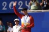 Spain's Carlos Alcaraz waves with his silver medal after losing to Serbia's Novak Djokovic in the men's singles tennis final at the Roland Garros stadium during the 2024 Summer Olympics, Sunday, Aug. 4, 2024, in Paris, France. Djokovic has won his first Olympic gold medal by beating Alcaraz 7-6 (3), 7-6 (2) in the 2024 Games men's tennis singles final. (AP Photo/Manu Fernandez)