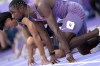 Noah Lyles, of the United States, prepares to start in the men's 100-meters semifinal at the 2024 Summer Olympics, Sunday, Aug. 4, 2024, in Saint-Denis, France. (AP Photo/Bernat Armangue)