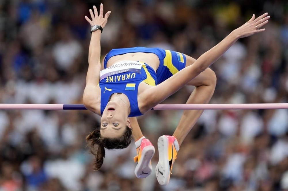 Yaroslava Mahuchikh, of Ukraine, competes in the women's high jump final at the 2024 Summer Olympics, Sunday, Aug. 4, 2024, in Saint-Denis, France. (AP Photo/Matthias Schrader)
