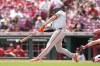 San Francisco Giants' Matt Chapman hits a single during the eighth inning of a baseball game against the Cincinnati Reds, Sunday, Aug. 4, 2024, in Cincinnati. (AP Photo/Jeff Dean)