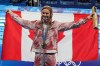 Canada's Summer McIntosh, of Toronto, celebrates with her gold medal after setting a new Olympic record in the 200m women's butterfly final during the 2024 Summer Olympic Games, in Paris, Thursday, Aug. 1, 2024. THE CANADIAN PRESS/Christinne Muschi