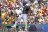 Pittsburgh Pirates' Isiah Kiner-Falefa reacts after hitting an RBI triple during the second inning of a baseball game against the Arizona Diamondbacks, Sunday, Aug. 4, 2024, in Pittsburgh. (AP Photo/Matt Freed)
