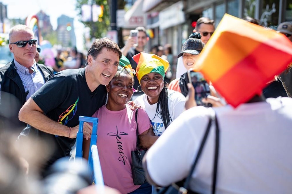 Prime Minister Justin Trudeau meets with people along Davie St. before the Pride Parade in Vancouver on Sunday August 4, 2024. THE CANADIAN PRESS/Ethan Cairns