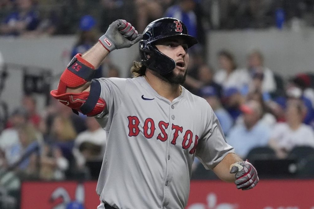 Boston Red Sox's Wilyer Abreu celebrates after hitting a home run during the fourth inning of a baseball game against the Texas Rangers in Arlington, Texas, Sunday, Aug. 4, 2024. (AP Photo/LM Otero)