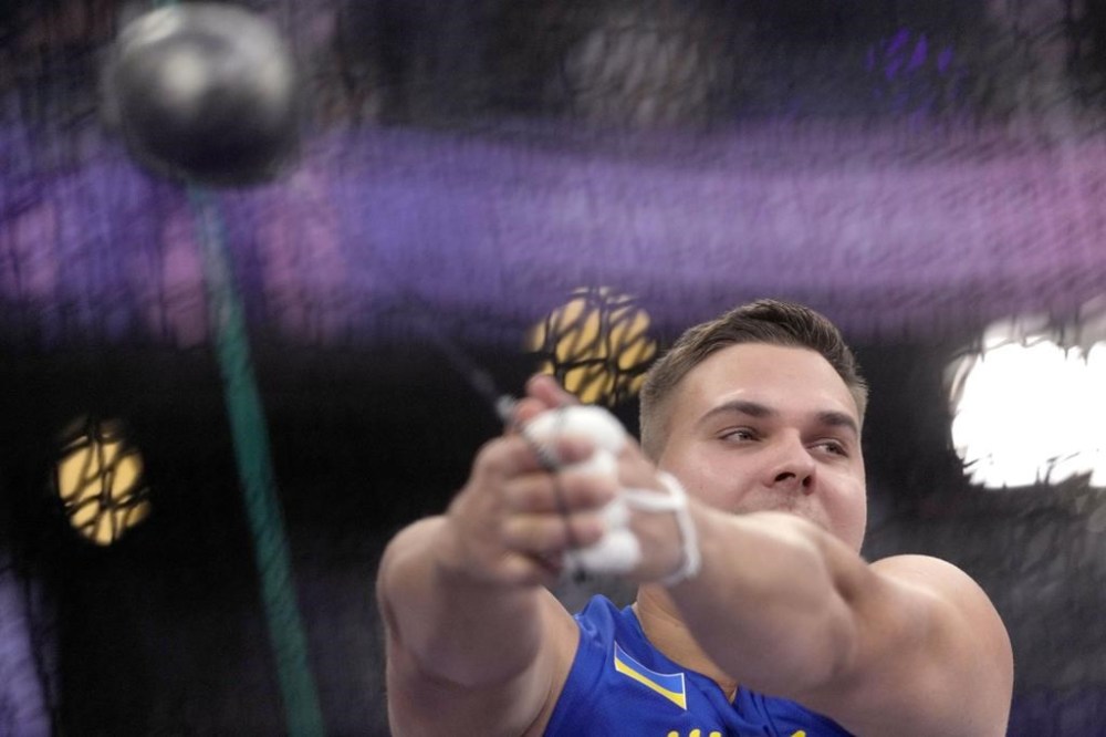 Mykhaylo Kokhan, of Ukraine, competes in the men's hammer throw final at the 2024 Summer Olympics, Sunday, Aug. 4, 2024, in Saint-Denis, France. (AP Photo/Bernat Armangue)