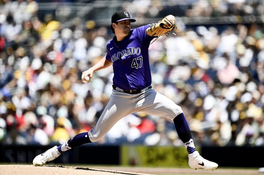 Colorado Rockies starting pitcher Cal Quantrill delivers during the first inning of a baseball game against the San Diego Padres, Sunday, Aug. 4, 2024, in San Diego. (AP Photo/Denis Poroy)