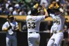 Oakland Athletics' Brent Rooker (25) celebrates with JJ Bleday (33) after hitting a two-run home run against the Los Angeles Dodgers during the first inning of a baseball game Sunday, Aug. 4, 2024, in Oakland, Calif. (AP Photo/Eakin Howard)