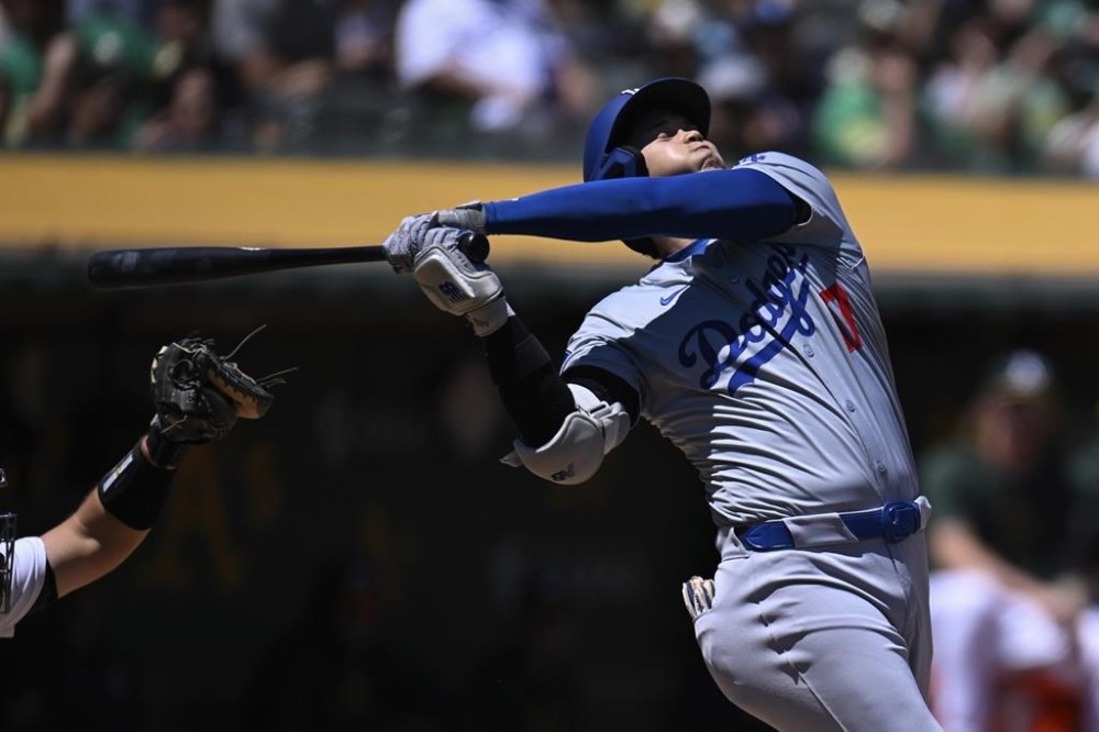 Los Angeles Dodgers' Shohei Ohtani swings for a strike during the second inning of a baseball game against the Oakland Athletics, Sunday, Aug. 4, 2024, in Oakland, Calif. (AP Photo/Eakin Howard)