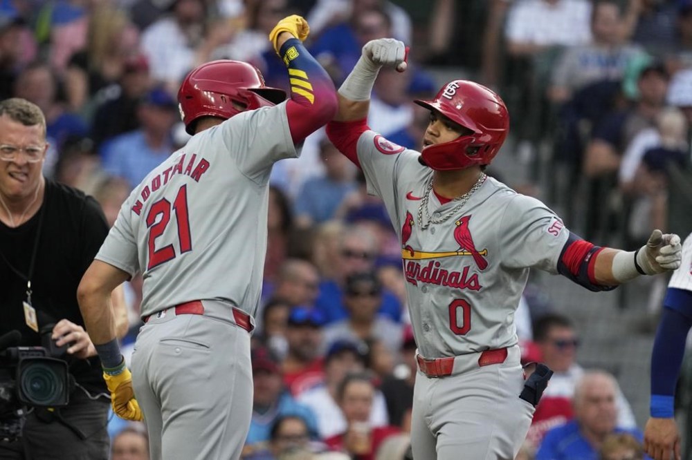 St. Louis Cardinals' Masyn Winn, right, celebrates with Lars Nootbaar after hitting a two-run home run during the third inning of a baseball game against the Chicago Cubs in Chicago, Sunday, Aug. 4, 2024. (AP Photo/Nam Y. Huh)