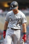 Chicago White Sox's Andrew Benintendi reacts to his strikeout during the eighth inning of a baseball game against the Minnesota Twins, Sunday, Aug. 4, 2024, in Minneapolis. (AP Photo/Matt Krohn)