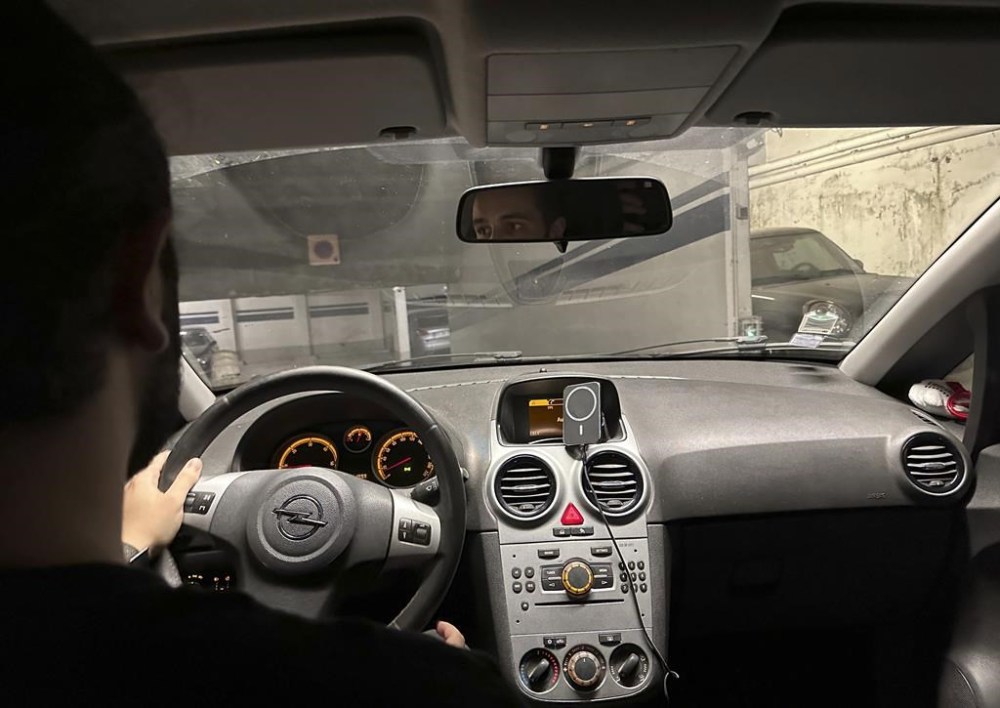 Amine, a 21-year-old student and apprentice bank worker, drives to a police station for his daily 6:30 p.m. obligatory check-in, Tuesday, July 30, 2024, in France. Amine is among more than 150 people whose movements have been restricted during the Paris Olympics because French authorities deem them to be potential terror risks for the Games. Amine says he’s not a threat and blames a police mix-up for his predicament. He is barred from leaving his suburb of Paris, except for his required daily trip to report to police. (AP Photo)