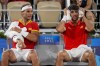 Rafael Nadal, left, and Carlos Alcaraz of Spain react during their match against Austin Krajicek and Rajeev Ram of the USA during the men's doubles quarter-final tennis competition at the Roland Garros stadium, at the 2024 Summer Olympics, Wednesday, July 31, 2024, in Paris, France. (AP Photo/Manu Fernandez)
