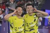 Taiwan's Lee Yang, left, and Wang Chi-Lin celebrate after defeating China's Liang Weikeng and Wang Chang at the end of their men's doubles gold medal match at the 2024 Summer Olympics, Sunday, Aug. 4, 2024, in Paris, France. (AP Photo/Dita Alangkara)