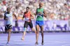 Alison Dos Santos, of Brazil, crosses the finish line to qualify in a men's 400 meters hurdles round 1 heat at the 2024 Summer Olympics, Monday, Aug. 5, 2024, in Saint-Denis, France. (AP Photo/Martin Meissner)