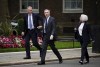 Chief of the Defence Staff Admiral Sir Tony Radakin, centre, arrives at Downing Street, where Prime Minister Sir Keir Starmer is chairing a meeting of the Government's emergency Cobra committee following ongoing unrest across parts of the country, in London, Monday Aug. 5, 2024. (Aaron Chown/PA via AP)