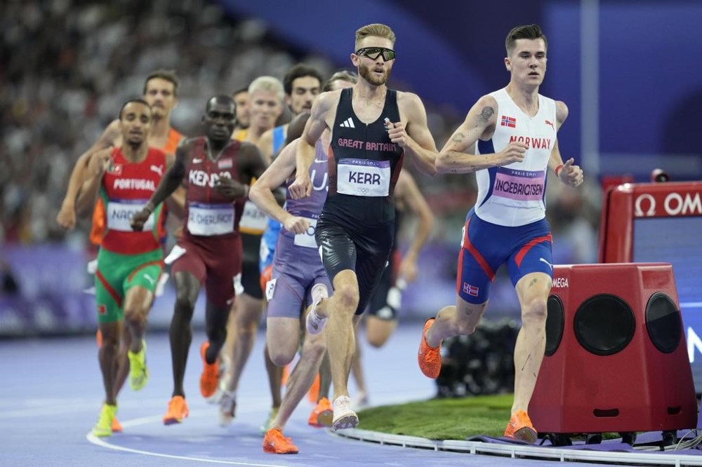 Jakob Ingebrigtsen, of Norway, and Josh Kerr, of Britain, run in a men's 1500 meters semifinal at the 2024 Summer Olympics, Sunday, Aug. 4, 2024, in Saint-Denis, France. (AP Photo/Ashley Landis)