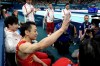 Zou Jingyuan, of China, celebrates after completing his routine in the men's artistic gymnastics individual parallel bars finals at Bercy Arena at the 2024 Summer Olympics, Monday, Aug. 5, 2024, in Paris, France. (AP Photo/Abbie Parr)