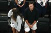 Tom Brady watches the end of the women's artistic gymnastics individual balance beam finals with his daughter Vivian in Bercy Arena at the 2024 Summer Olympics, Monday, Aug. 5, 2024, in Paris, France. (AP Photo/Morry Gash)