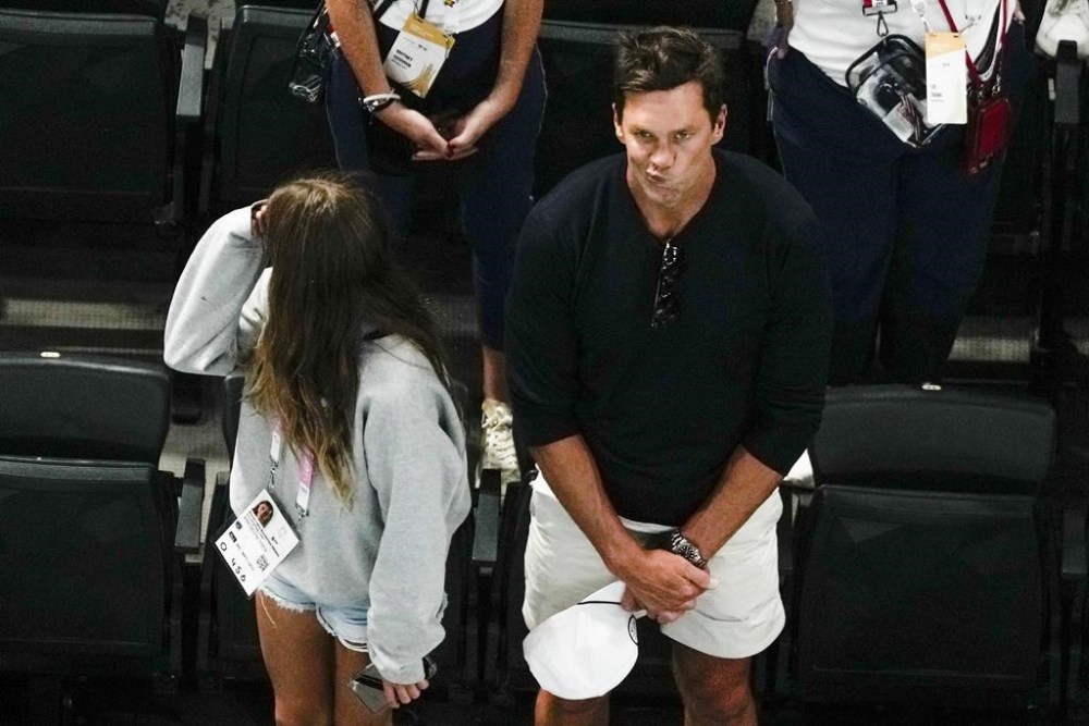 Tom Brady watches the end of the women's artistic gymnastics individual balance beam finals with his daughter Vivian in Bercy Arena at the 2024 Summer Olympics, Monday, Aug. 5, 2024, in Paris, France. (AP Photo/Morry Gash)