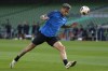FILE -Atalanta's Gianluca Scamacca heads the ball during a training session one day ahead of the Europa League soccer Final between Atalanta and Bayer Leverkusen at the Aviva Stadium in Dublin, Ireland, May 21, 2024 . (AP Photo/Kirsty Wigglesworth), File)