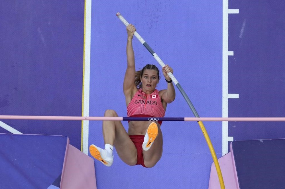 Alysha Newman, of Canada, competes in the women's pole vault qualification at the 2024 Summer Olympics, Monday, Aug. 5, 2024, in Saint-Denis, France. (AP Photo/David J. Phillip)