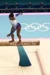 Simone Biles, of the United States, falls on the beam during the women's artistic gymnastics individual balance beam finals in Bercy Arena at the 2024 Summer Olympics, Monday, Aug. 5, 2024, in Paris, France. (AP Photo/Morry Gash)