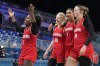 Germany's Alexis Peterson (1) celebrates withe teammates Germany's Frieda Buhner (20), Germany's Satou Sabally (0) and Germany's Lina Sontag after Germany defeated Japan in a women's basketball game at the 2024 Summer Olympics, Thursday, Aug. 1, 2024, in Villeneuve-d'Ascq, France. (AP Photo/Michael Conroy)