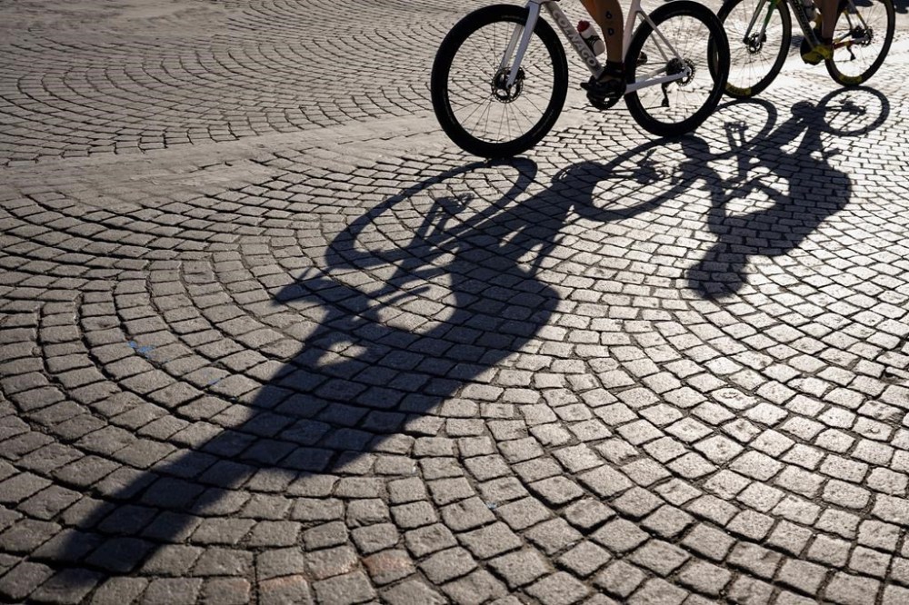 Athletes compete during the bike leg of mixed relay triathlon at the 2024 Summer Olympics, Monday, Aug. 5, 2024, in Paris, France. (AP Photo/David Goldman)