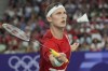 Denmark's Viktor Axelsen plays against Thailand's Kunlavut Vitidsarn during their men's singles badminton gold medal match at the 2024 Summer Olympics, Monday, Aug. 5, 2024, in Paris, France. (AP Photo/Dita Alangkara)