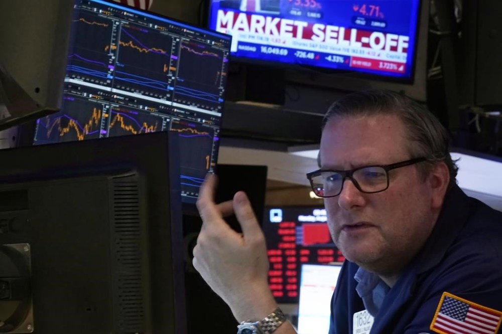 Specialist Gregg Maloney works at his post on the floor of the New York Stock Exchange, Monday, Aug. 5, 2024. Nearly everything on Wall Street is tumbling as fear about a slowing U.S. economy worsens and sets off another sell-off for financial markets around the world. (AP Photo/Richard Drew)