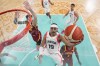 Andrew Nembhard, of Canada, shoots in front of Juancho Hernangomez, left, and Lorenzo Brown, of Spain, in a men's basketball game at the 2024 Summer Olympics, Friday, Aug. 2, 2024, in Villeneuve-d'Ascq, France. THE CANADIAN PRESS/AP-Mark J. Terrill