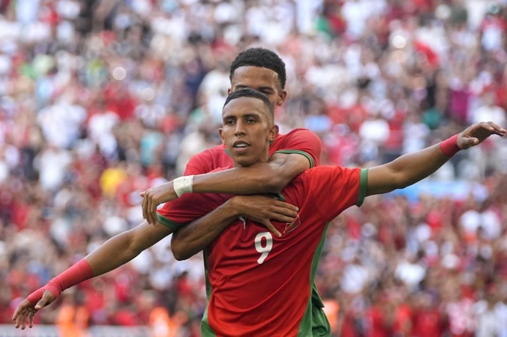 Morocco's Soufiane Rahimi celebrates scoring a penalty goal during a men's semifinal soccer match between Morocco and Spain at the 2024 Summer Olympics, Monday, Aug. 5, 2024, at Marseille Stadium in Marseille, France. (AP Photo/Julio Cortez)