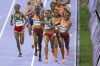 Faith Kipyegon, of Kenya,, right, fights for the lead with Gudaf Tsegay, of Ethiopia, during the women's 5000 meters final at the 2024 Summer Olympics, Monday, Aug. 5, 2024, in Saint-Denis, France. (AP Photo/Martin Meissner)