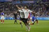 Egypt's Mahmoud Saber, right, celebrates with teammate Zizo after scoring his side's opening goal during the men's semifinal soccer match between France and Egypt, at Lyon Stadium, during the 2024 Summer Olympics, Monday, Aug. 5, 2024, in Decines, France. (AP Photo/Silvia Izquierdo)