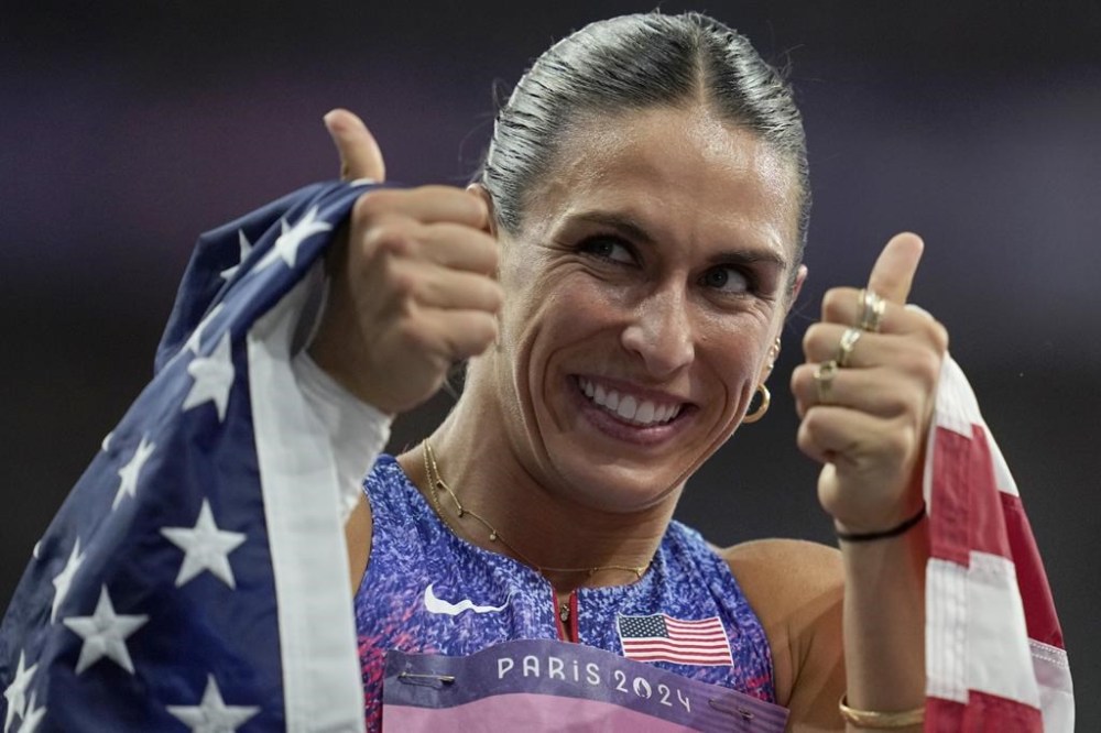 Valarie Allman, of the United States, gestures after winning the gold medal in the women's discus throw final at the 2024 Summer Olympics, Monday, Aug. 5, 2024, in Saint-Denis, France. (AP Photo/Ashley Landis)