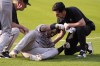 Arizona Diamondbacks' Gabriel Moreno is helped up after an injury in the second inning of a baseball game against the Cleveland Guardians in Cleveland, Monday, Aug. 5, 2024. (AP Photo/Sue Ogrocki)