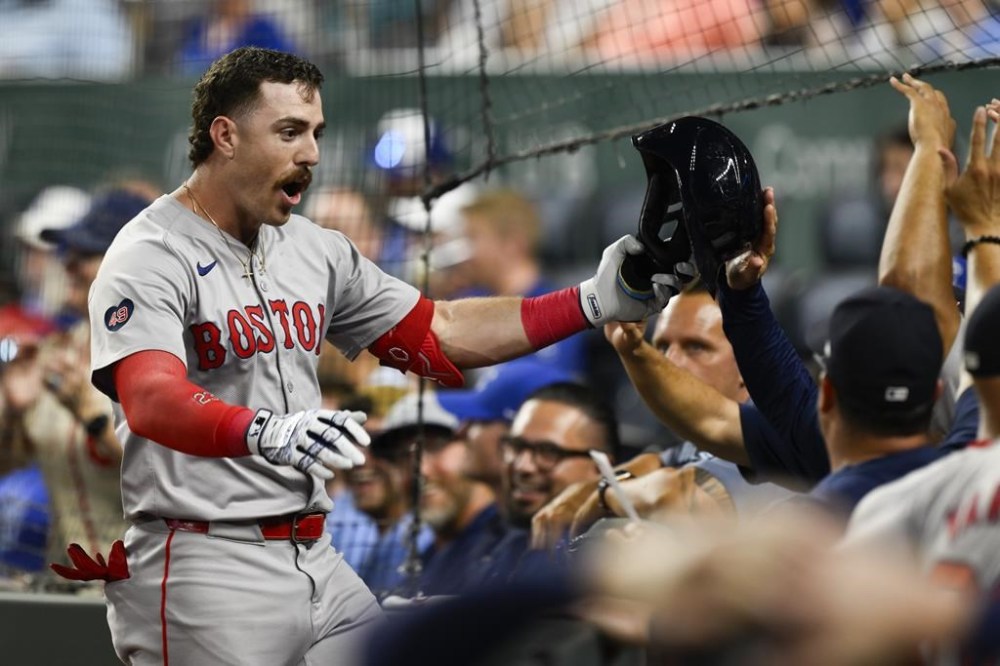 Boston Red Sox's Romy Gonzalez celebrates his three-run home run during the seventh inning of a baseball game against the Kansas City Royals, Monday, Aug. 5, 2024, in Kansas City, Mo. (AP Photo/Reed Hoffmann)