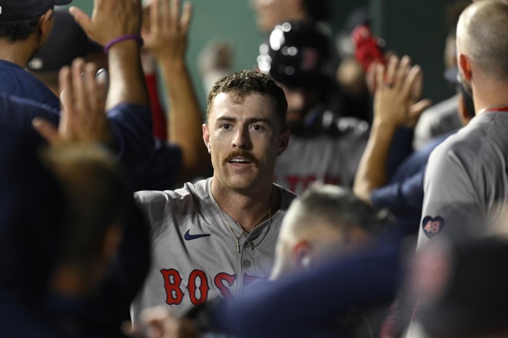 Boston Red Sox's Romy Gonzalez celebrates his three-run home run during the seventh inning of a baseball game against the Kansas City Royals, Monday, Aug. 5, 2024, in Kansas City, Mo. (AP Photo/Reed Hoffmann)