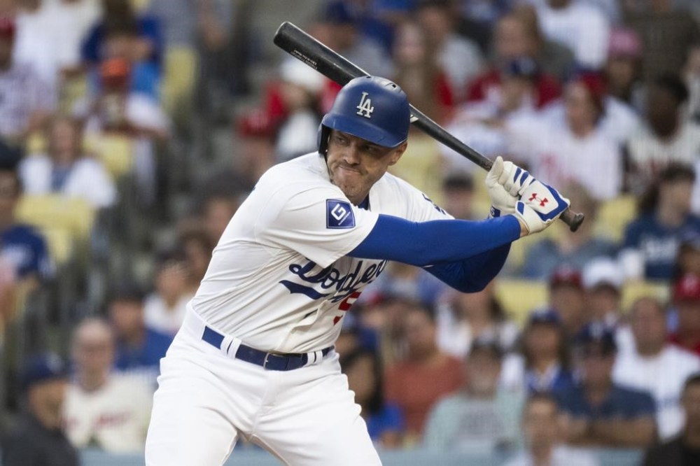Los Angeles Dodgers' Freddie Freeman bats during the first inning of a baseball game against the Philadelphia Phillies in Los Angeles, Monday, Aug. 5, 2024. Freeman has missed last eight games as his youngest son Maximus was diagnosed with Guillan-Barre syndrome. (AP Photo/Kyusung Gong)