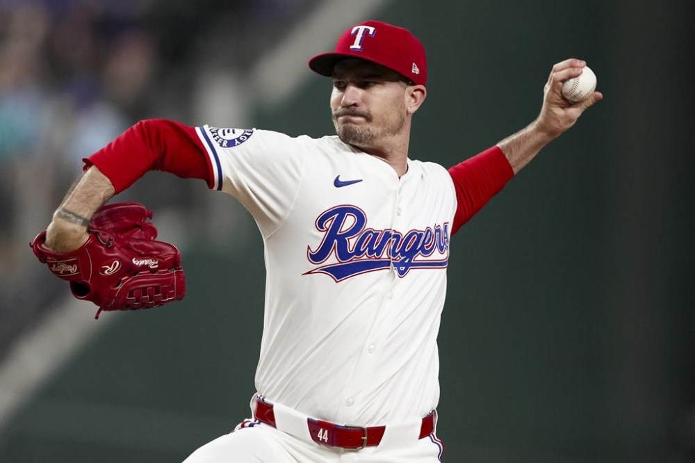 Texas Rangers starting pitcher Andrew Heaney throws during the first inning of a baseball game against the Houston Astros, Monday, Aug. 5, 2024, in Arlington, Texas. (AP Photo/Sam Hodde)