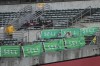 Fans at Oakland-Alameda County Coliseum sit behind signs calling for Oakland Athletics management to sell the team during the sixth inning of a baseball game between the Athletics and the Chicago White Sox in Oakland, Calif., Monday, Aug. 5, 2024. (AP Photo/Jeff Chiu)