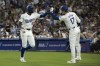 Los Angeles Dodgers outfielder Jason Heyward (23) celebrates after scoring on an RBI double by Andy Pages with Shohei Ohtani (17) during the third inning of a baseball game against the Philadelphia Phillies in Los Angeles, Monday, Aug. 5, 2024. (AP Photo/Kyusung Gong)