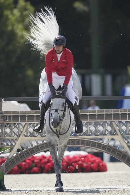 Germany's Christian Kukuk rides Checker 47 during the Jumping Individual final at the 2024 Summer Olympics, Tuesday, Aug. 6, 2024, in Versailles, France. (AP Photo/Mosa'ab Elshamy)